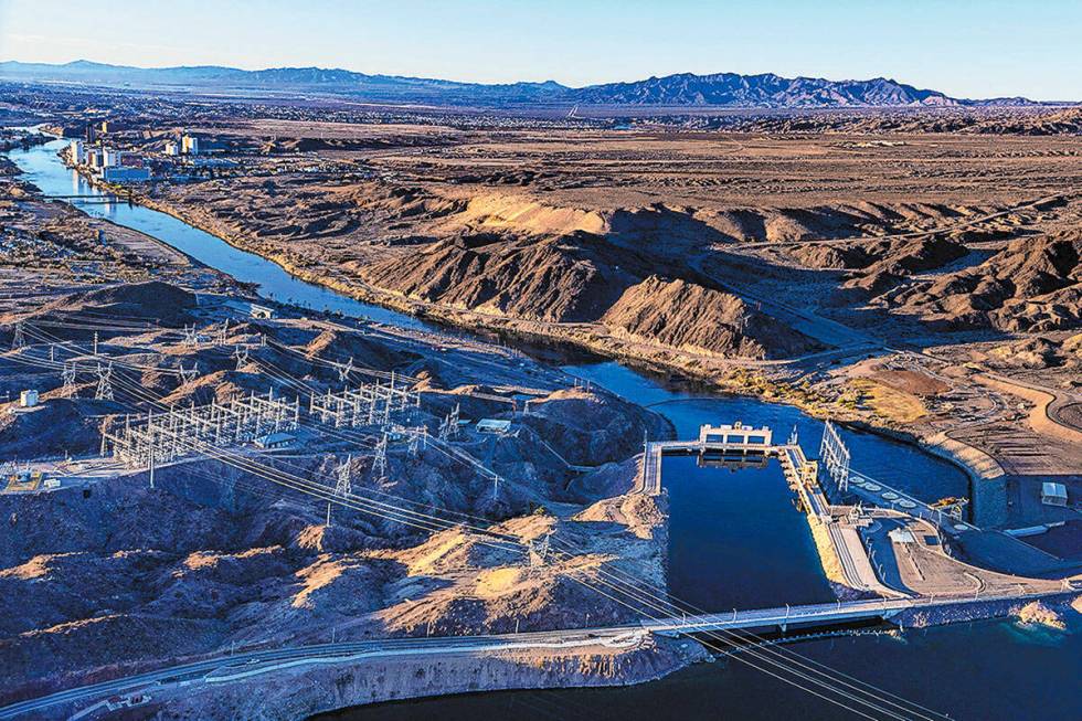 Morning lights the Davis Dam and beyond along the Colorado River on Thursday, Jan. 28, 2023, no ...