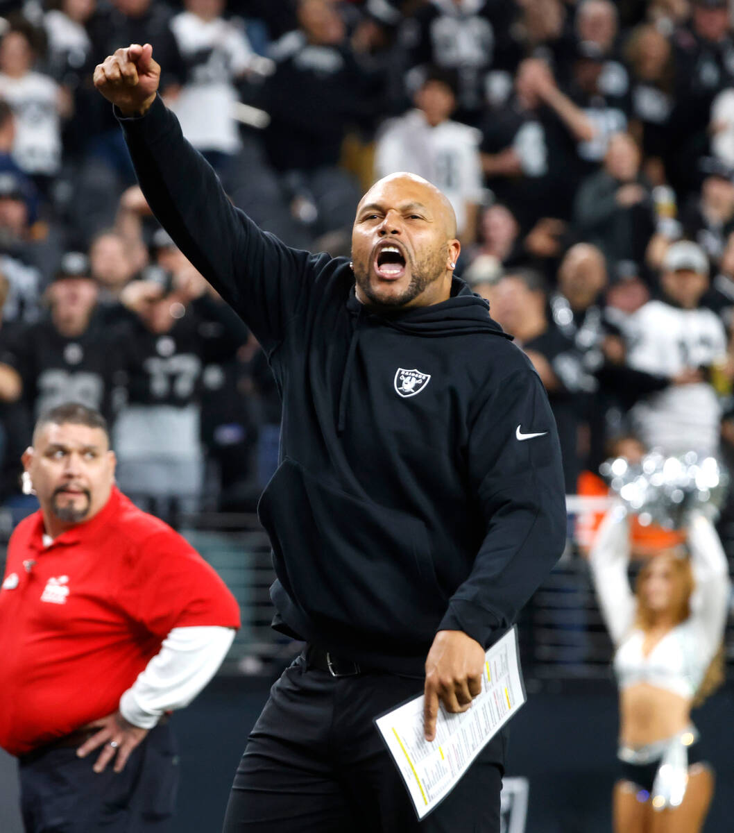 Raiders Interim Coach Antonio Pierce reacts as he leaves the field after beating the Denver Bro ...