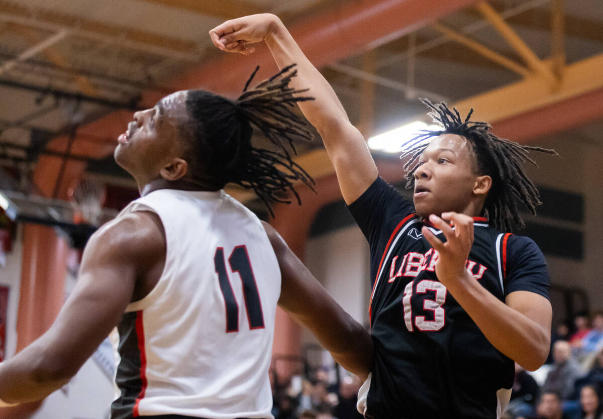 Liberty’s Jaden Riley (13) takes a shot past Arbor View’s Brian “Chef&#x20 ...