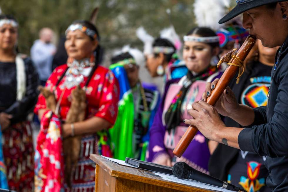 Davis Thunderhawk plays the flute during a Super Bowl "Green Week" event at the Las V ...