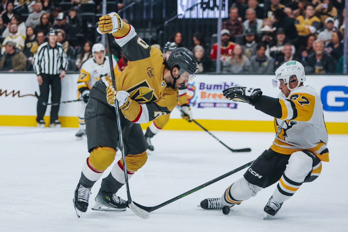 Golden Knights center Chandler Stephenson (20) looks for the puck beneath him during a game aga ...