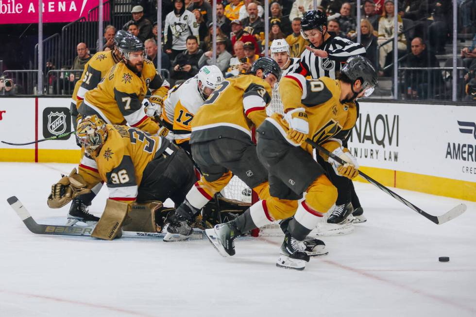 Golden Knights center Chandler Stephenson (20) chases after the puck as the Golden Knights figh ...