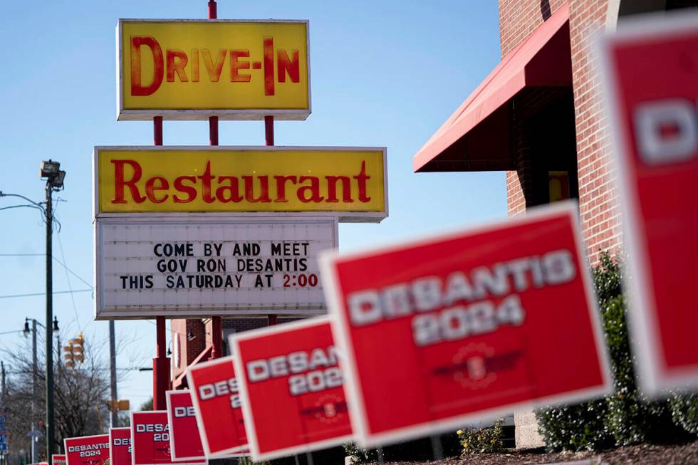 Campaign signs are mounted outside an event for Republican presidential candidate Florida Gov. ...