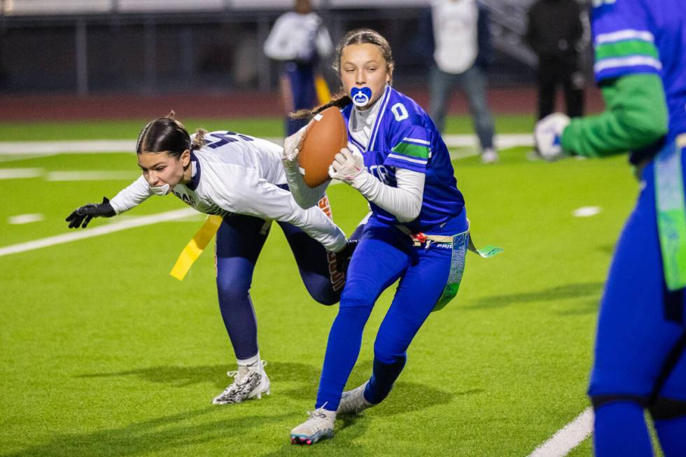 Green Valley’s Kaylee Montalvo (0) pushes past Legacy’s Larissa Lotta (5) during ...