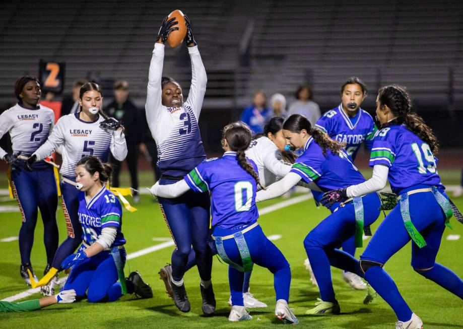 Legacy’s Mailaya Taylor (3) looks to evade Green Valley players during a flag football g ...