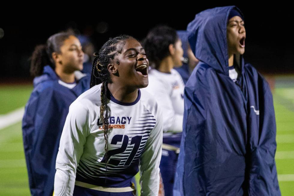 Legacy’s Olivia Hubbard (21) cheers on her teammates at they make a touchdown during a f ...