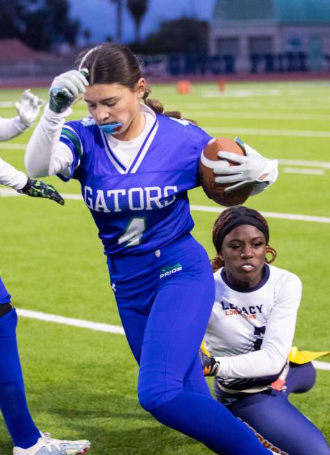 Legacy’s Samiyah Washington (2) pulls the flag off of Green Valley’s Lauryn Galvi ...