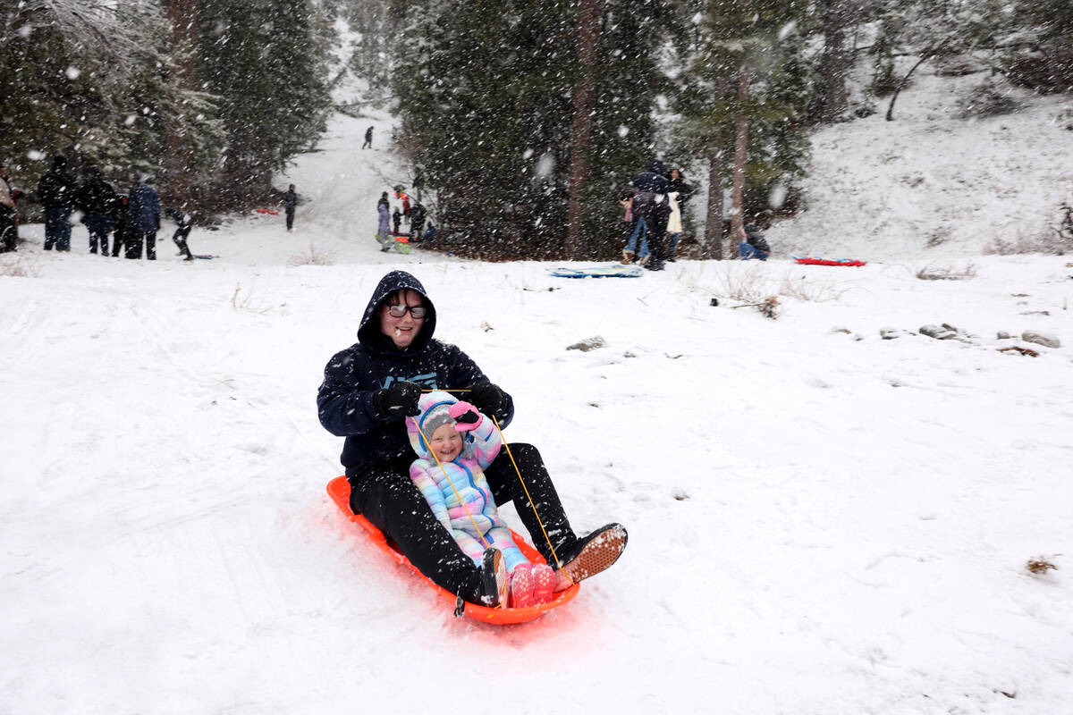 Ire-Lynn Rettinger, 2, plays with her brother Aiden, 16, off the side of the road in Kyle Canyo ...