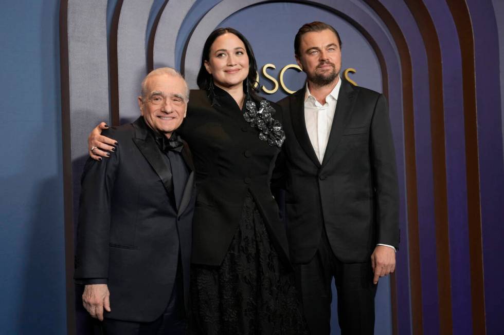 Martin Scorsese, from left, Lily Gladstone, and Leonardo DiCaprio arrive at the Governors Award ...