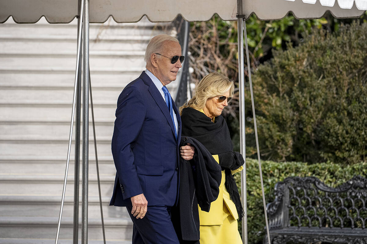 President Joe Biden and first lady Jill Biden walk towards Marine One on the South Lawn of the ...