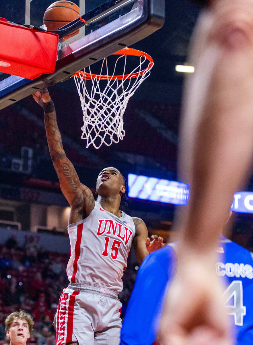 UNLV guard Luis Rodriguez (15) gets to the hoop past the Air Force Falcons defense during the f ...