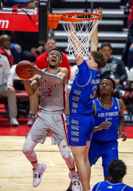 UNLV guard Justin Webster (2) battles to the basket against Air Force Falcons forward Luke Kear ...