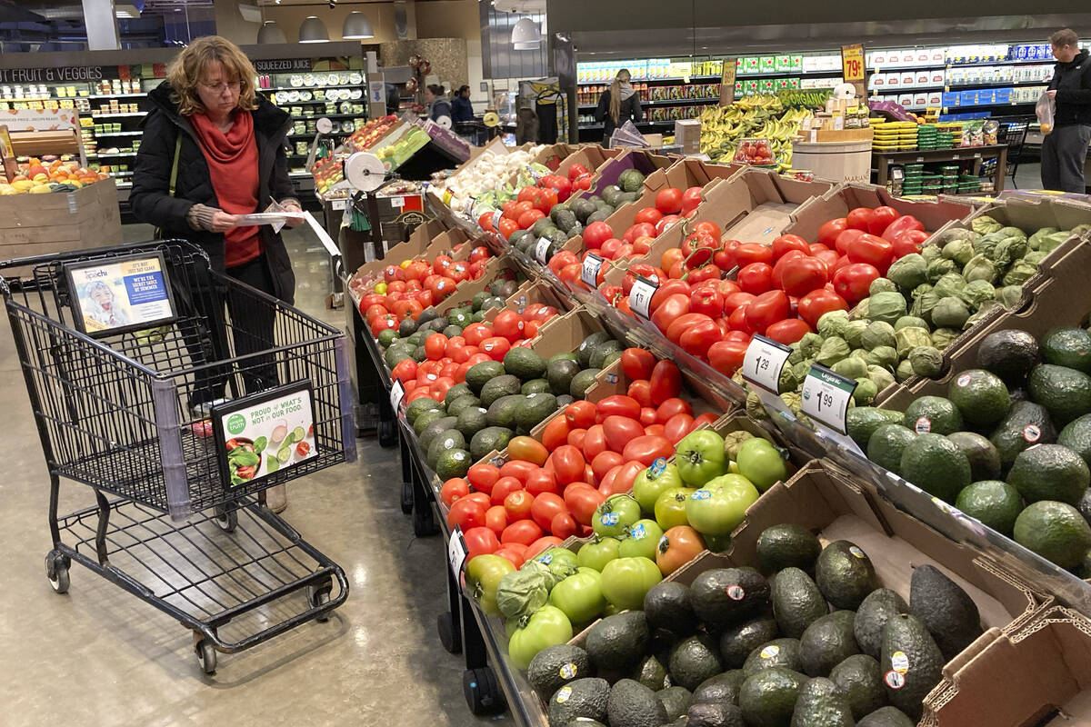 Shoppers pick out items at a grocery store in this AP file photo. (AP Photo/Nam Y. Huh, File)