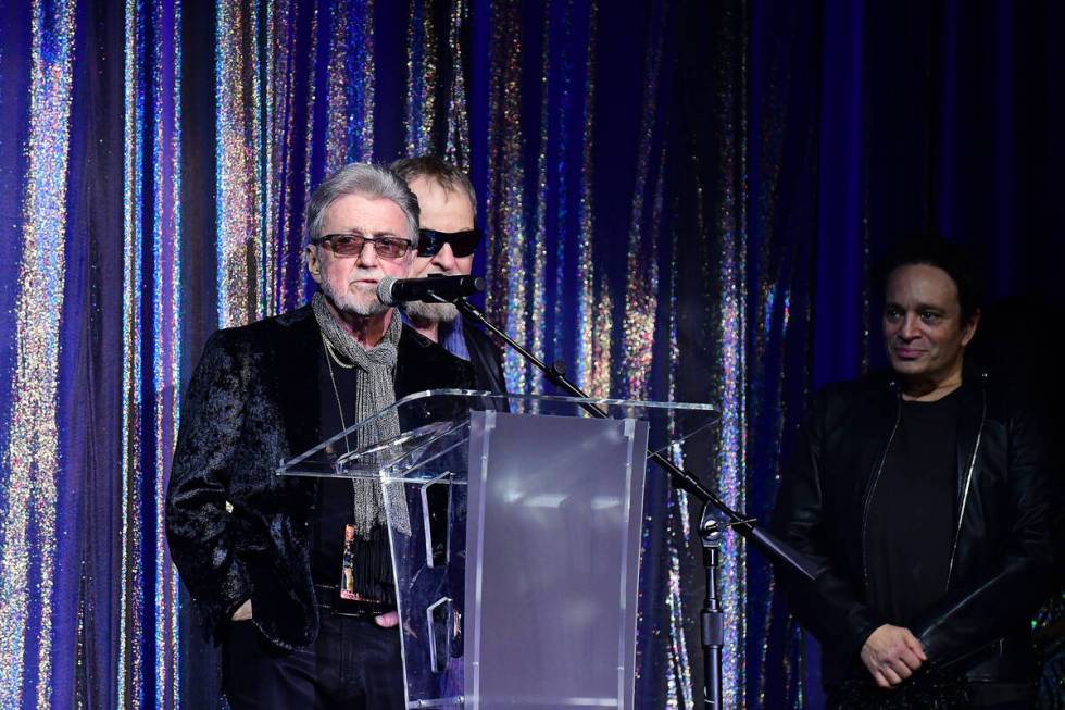 Eric Bloom and Buck Dharma of Blue Oyster Cult are shown with ex-"SNL" cast member Chris Kattan ...