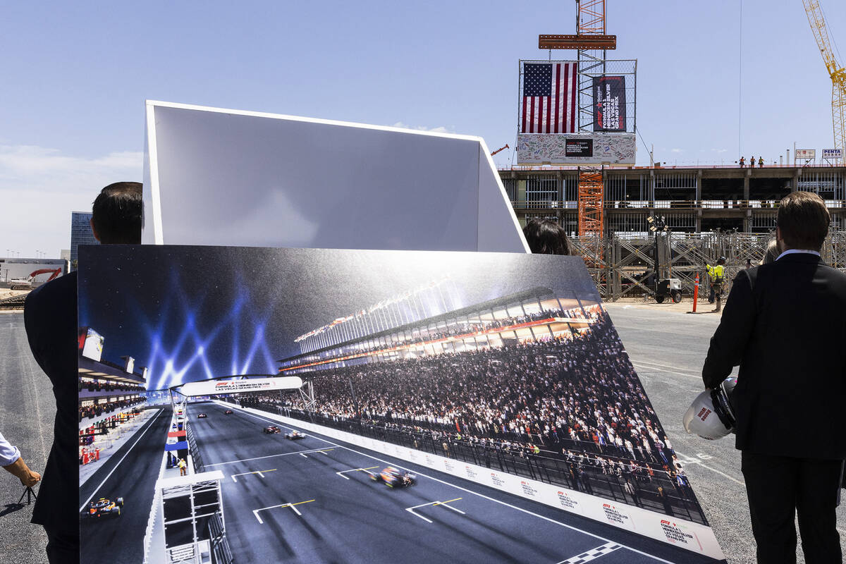 Construction crews hoist a barrier during a topping off ceremony for the Formula One Las Vegas ...