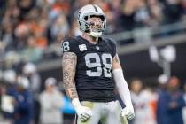Raiders defensive end Maxx Crosby (98) celebrates a sack during the first half of an NFL game a ...