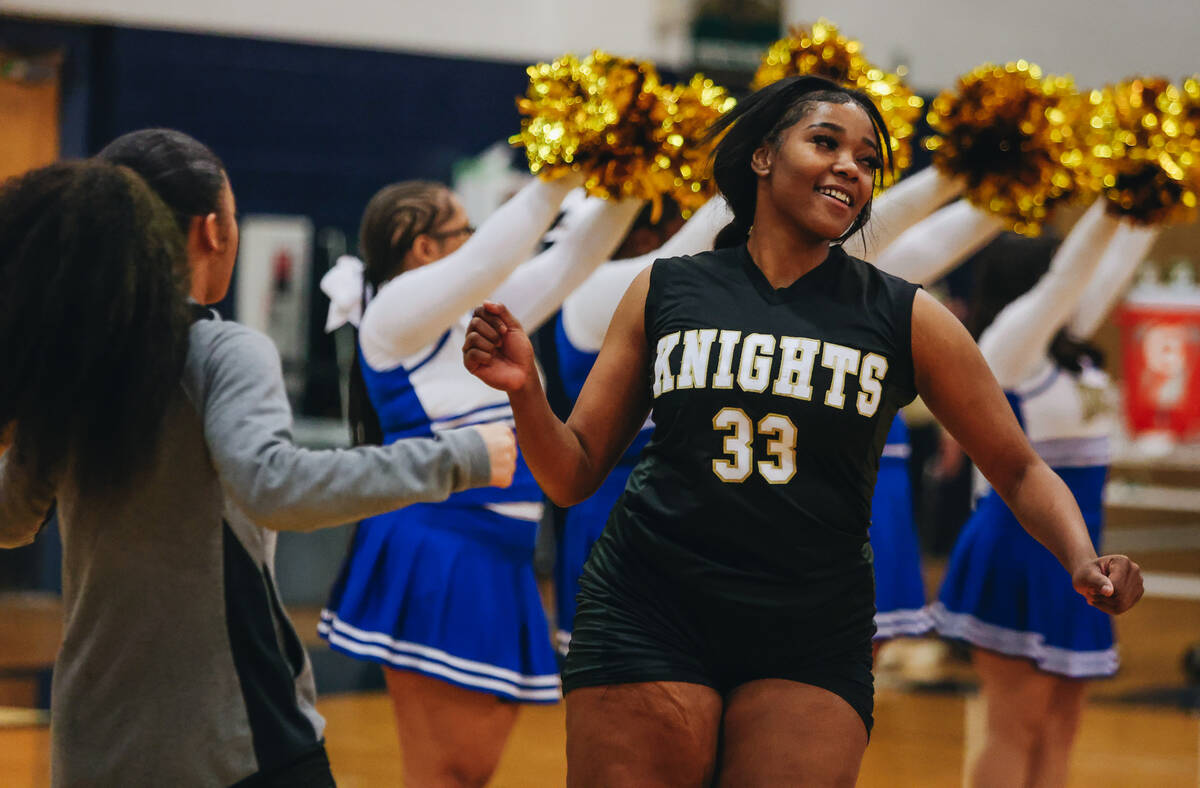 Democracy Prep power forward Heaven Spencer runs onto the court as her team is announced before ...