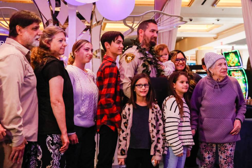 Officers Jacob Noriega poses for a photo alongside his family as he is honored with the &#x201c ...