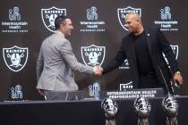 Tom Telesco, left, and Antonio Pierce are introduced as general manager and coach during a pres ...