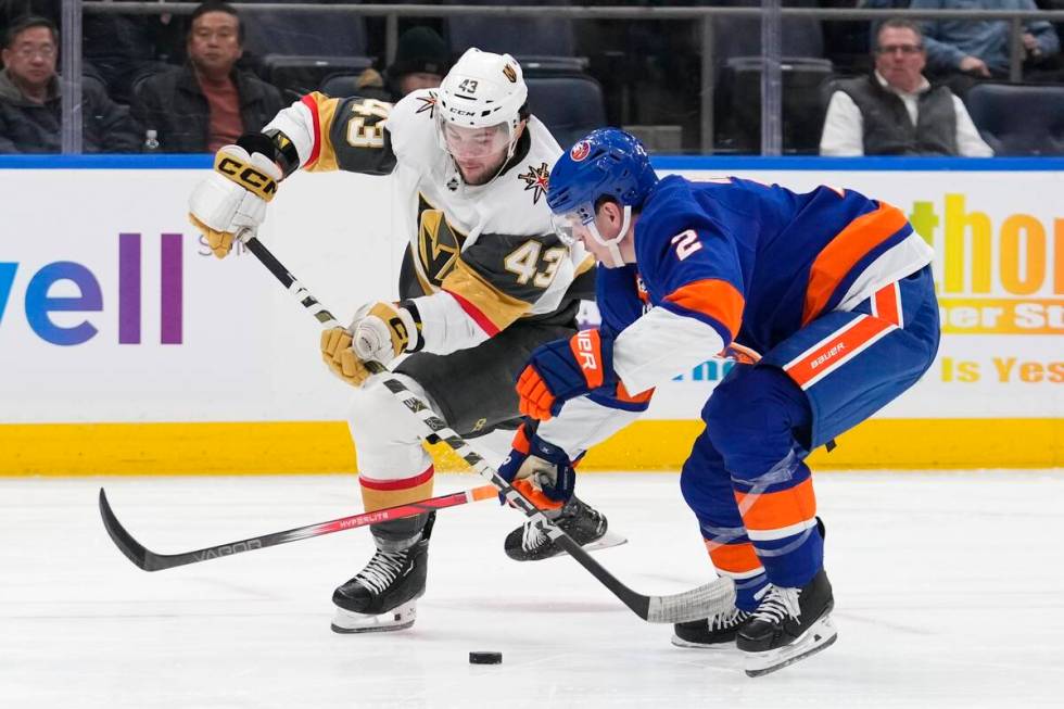 New York Islanders' Mike Reilly (2) defends against Vegas Golden Knights' Paul Cotter (43) duri ...