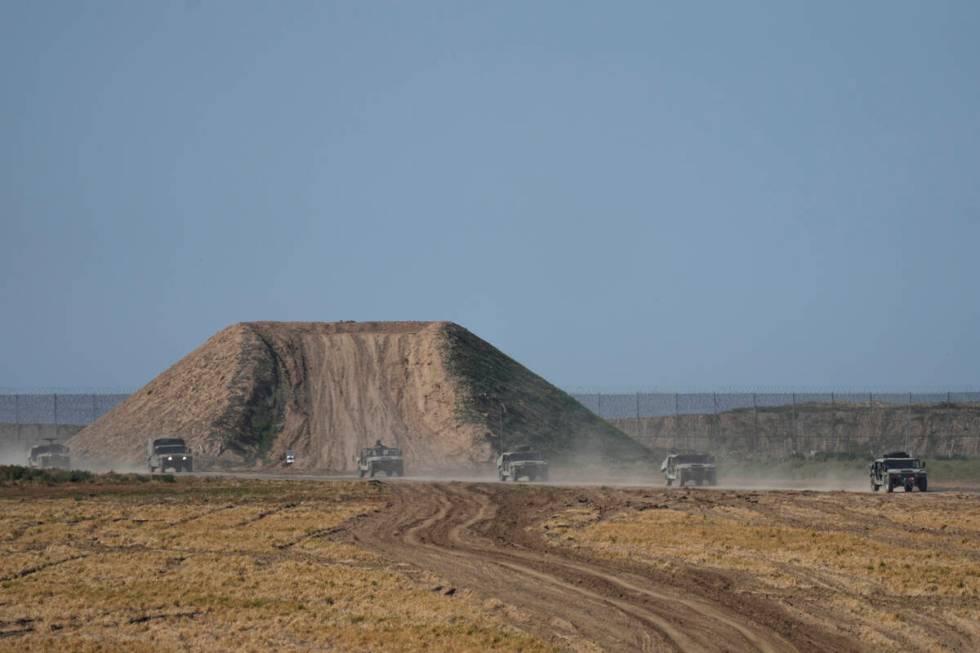 Israeli forces move near the Gaza Strip border in southern Israel, Thursday, Jan. 25, 2024. The ...