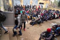 Indian workers aspiring to be hired for jobs in Israel line up during a recruitment drive in Lu ...