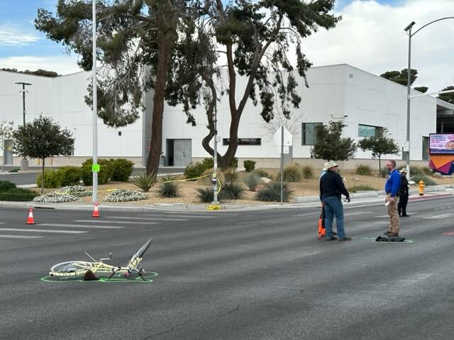 A mangled bicycle rests in the intersection of East Bonanza Road and Wardelle Street after a cr ...
