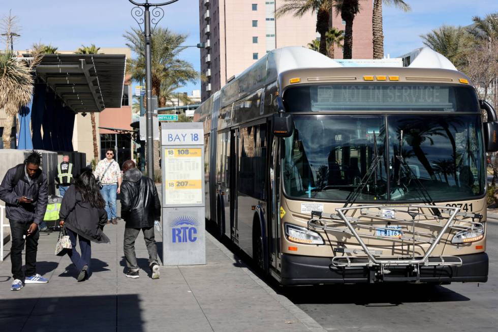 A Regional Transportation Commission bus driver picks up passengers at Bonneville Transit Cente ...