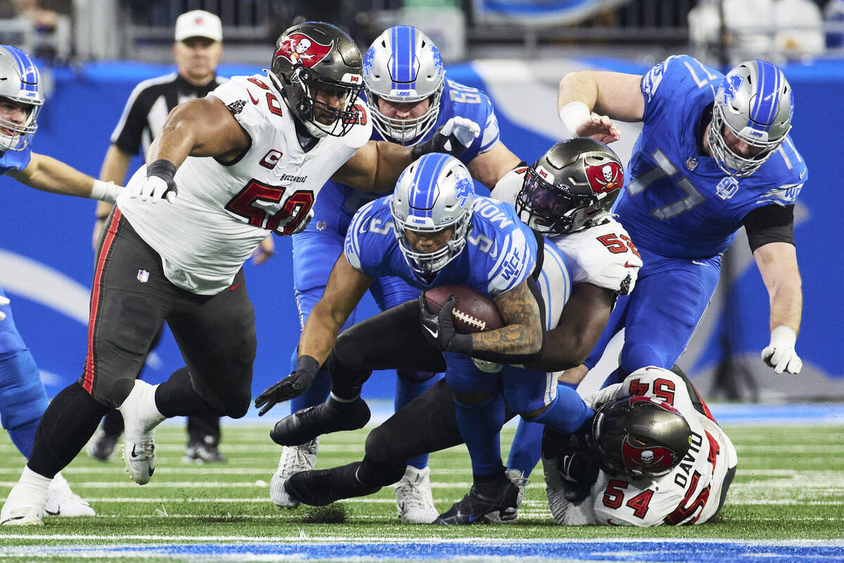 Detroit Lions running back David Montgomery (5) is tackled by Tampa Bay Buccaneers linebacker K ...