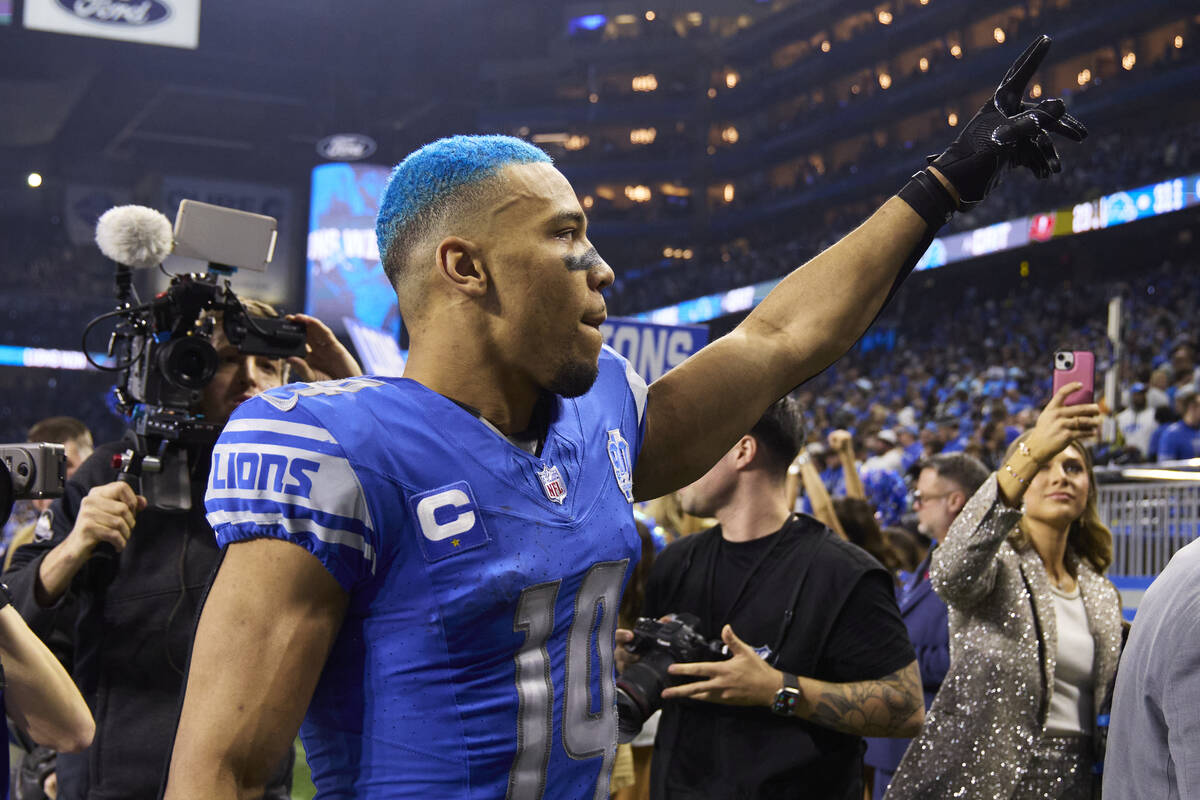 Detroit Lions wide receiver Amon-Ra St. Brown (14) celebrate after defeating the Tampa Bay Bucc ...
