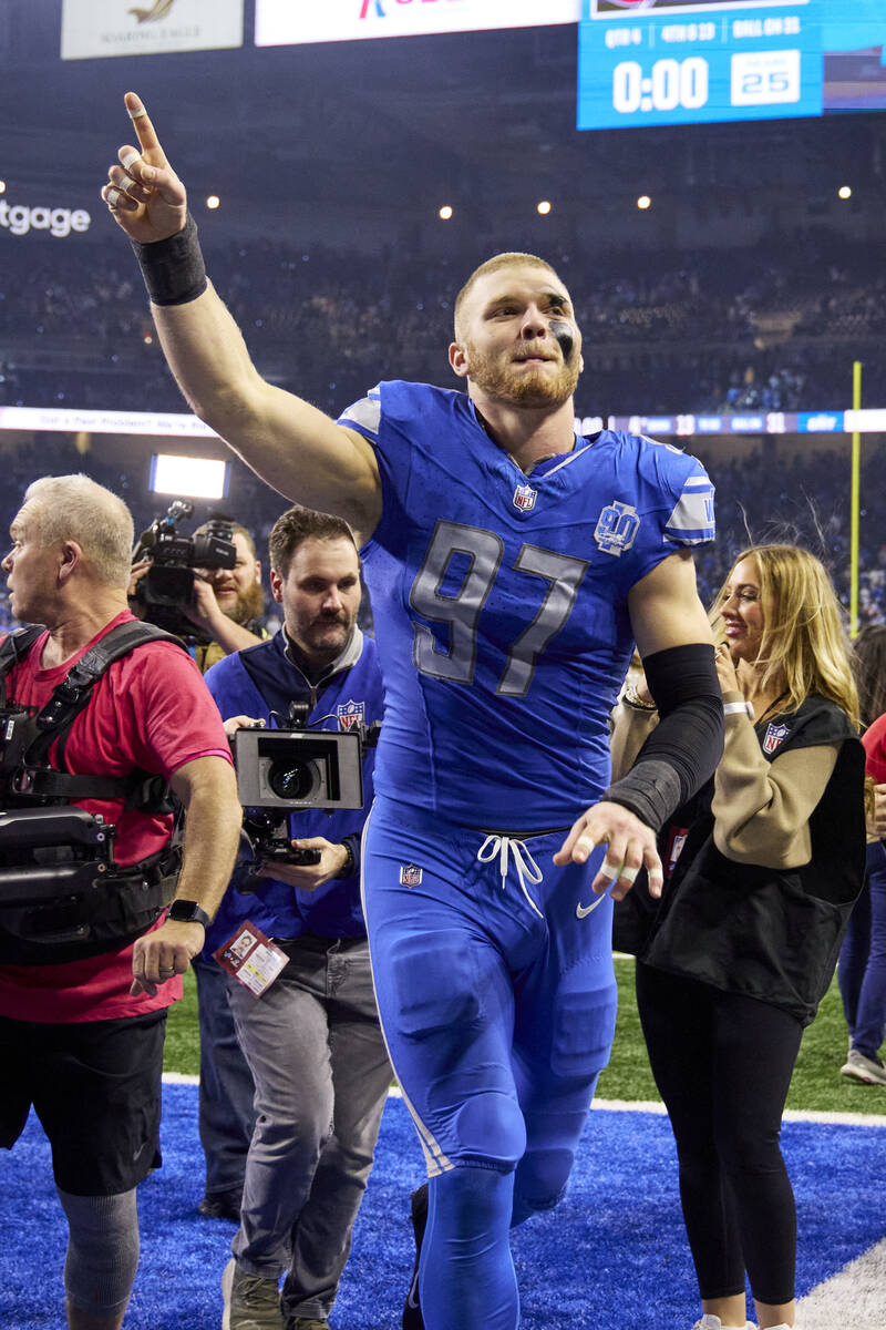 Detroit Lions defensive end Aidan Hutchinson (97) celebrate after defeating the Tampa Bay Bucca ...