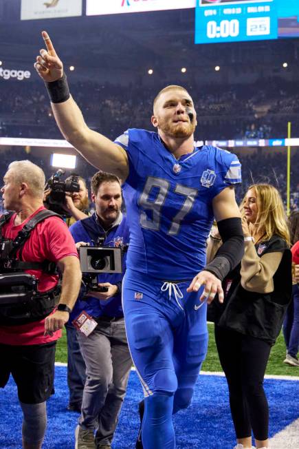 Detroit Lions defensive end Aidan Hutchinson (97) celebrate after defeating the Tampa Bay Bucca ...