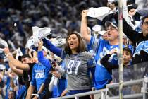 Detroit Lions fans cheer during the second half of an NFL football NFC divisional playoff game ...