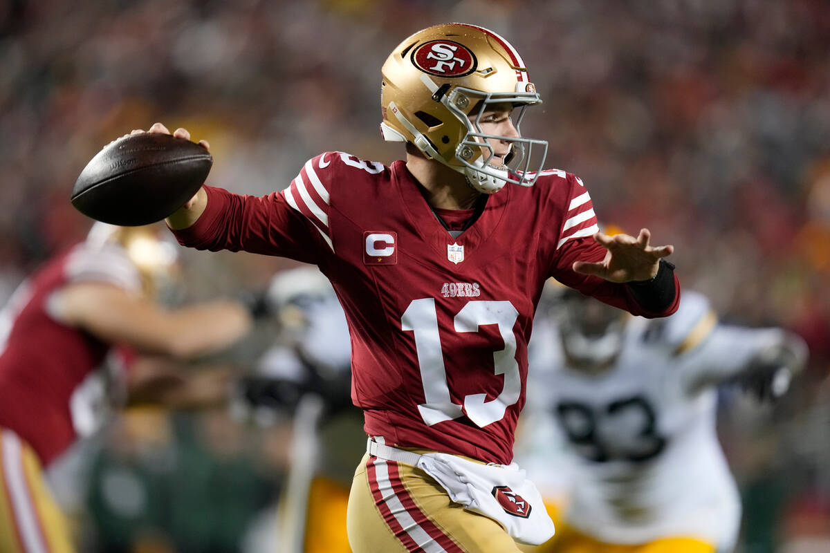 FILE - San Francisco 49ers quarterback Brock Purdy (13) throws during an NFL football game agai ...