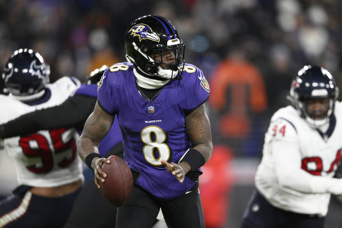FILE - Baltimore Ravens quarterback Lamar Jackson (8) plays during the first half of an AFC div ...