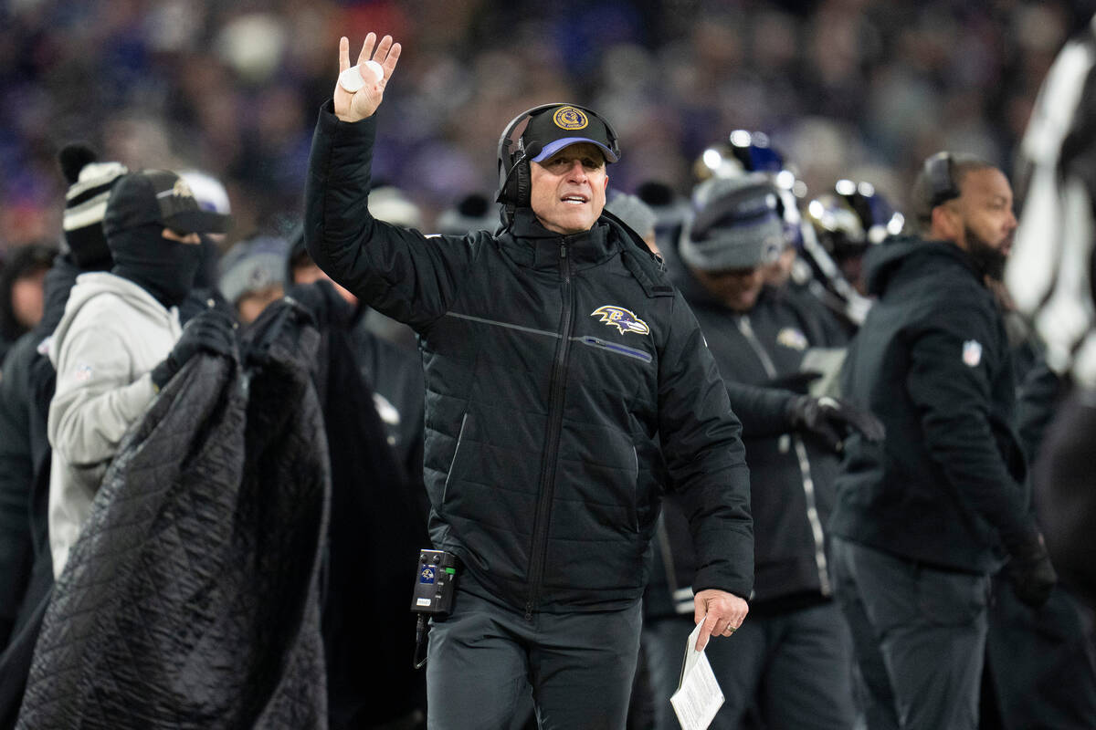 Baltimore Ravens head coach John Harbaugh reacts during an NFL football AFC divisional playoff ...