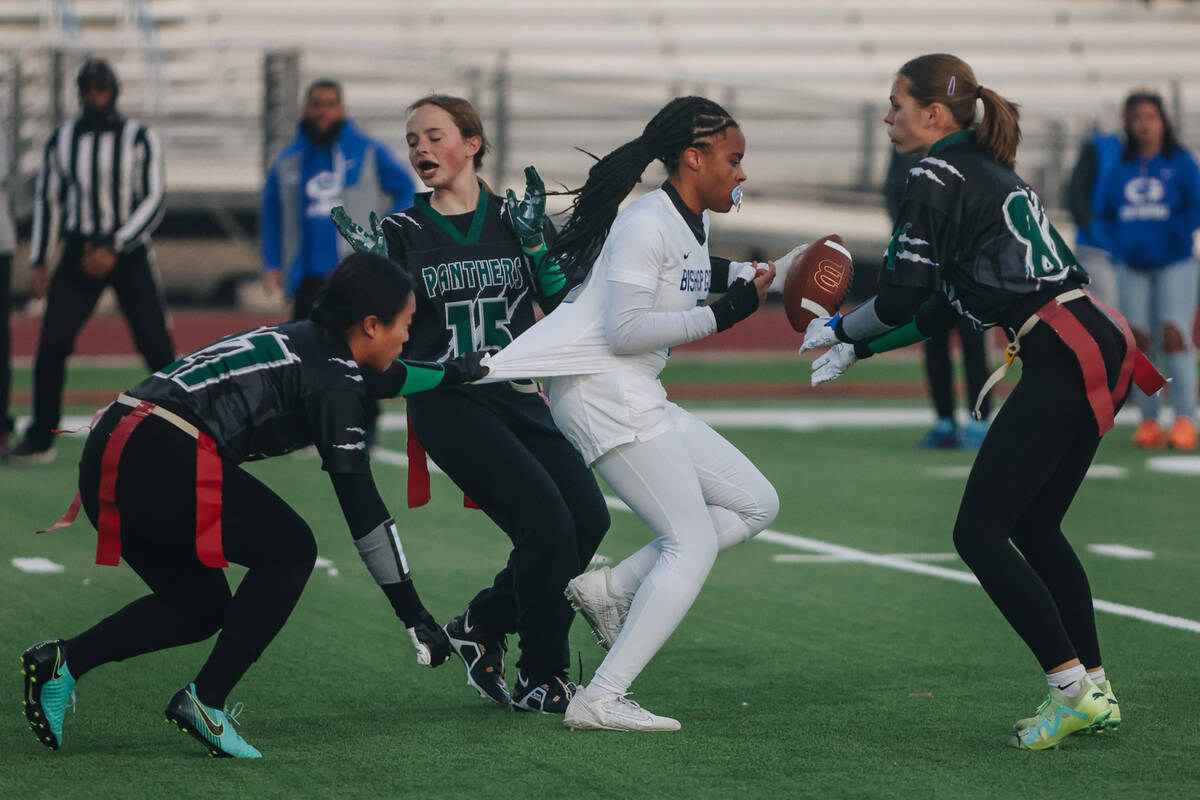 Bishop Gorman running back Nia Parks (5) runs with the ball as her shirt gets snagged along wit ...