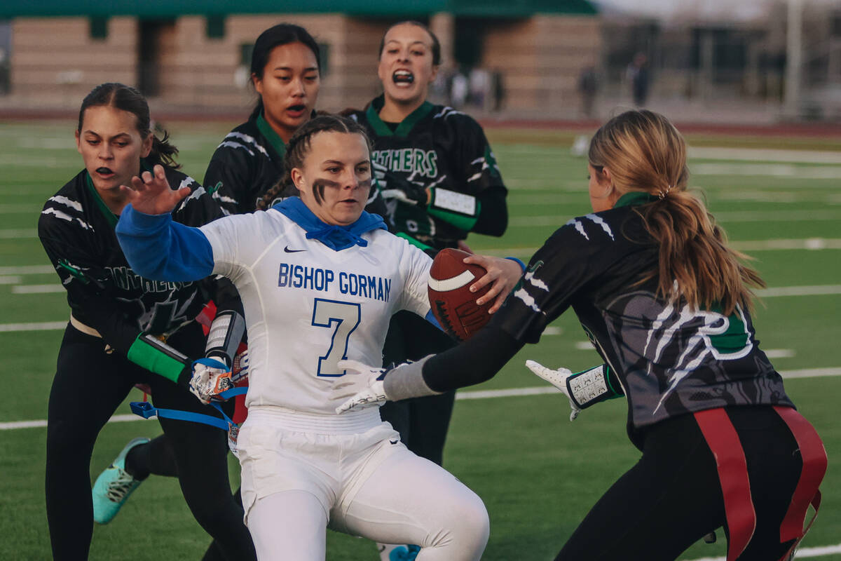 Bishop Gorman quarterback Avery Reed (7) gets her flags pulled during a flag football game at P ...