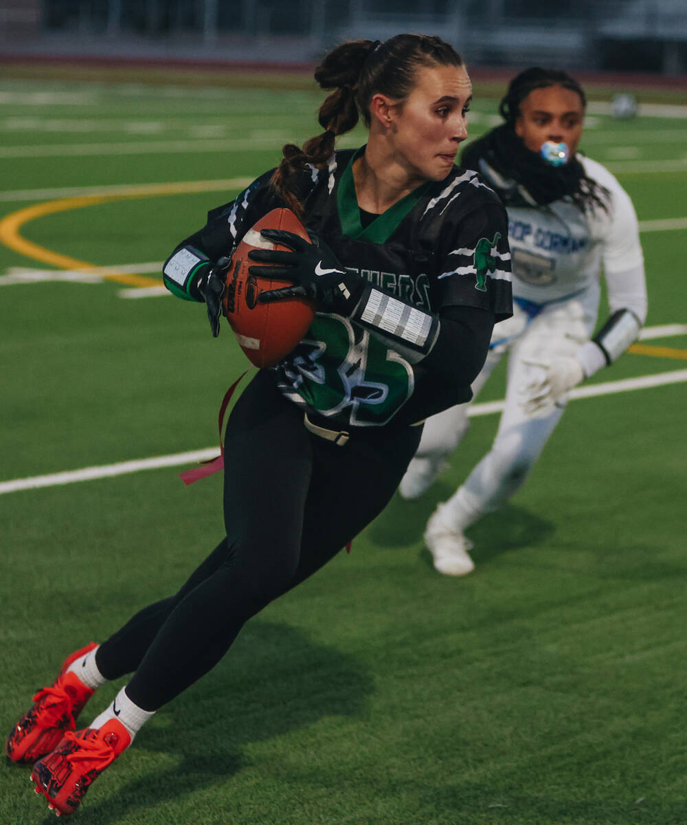 Palo Verde defensive back Tia Brown (35) runs with then ball during a flag football game agains ...