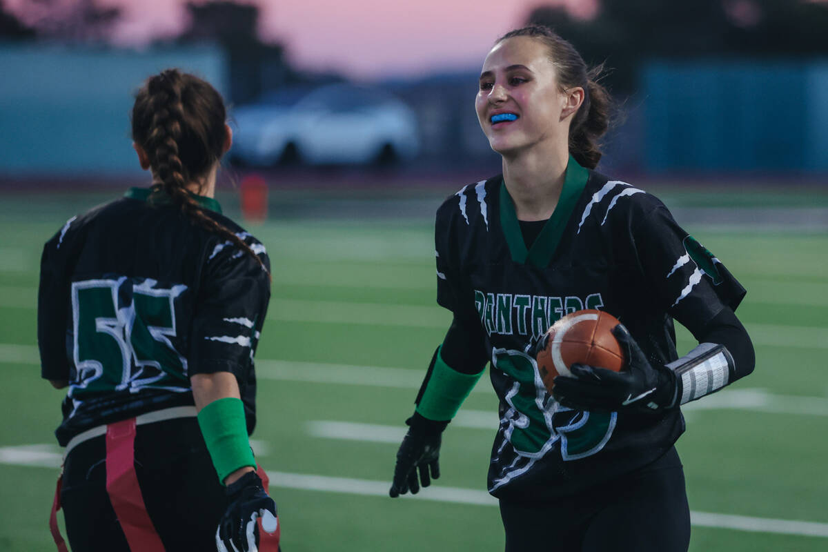 Palo Verde defensive back Tia Brown (35) smiles at her teammates after a run with the ball duri ...