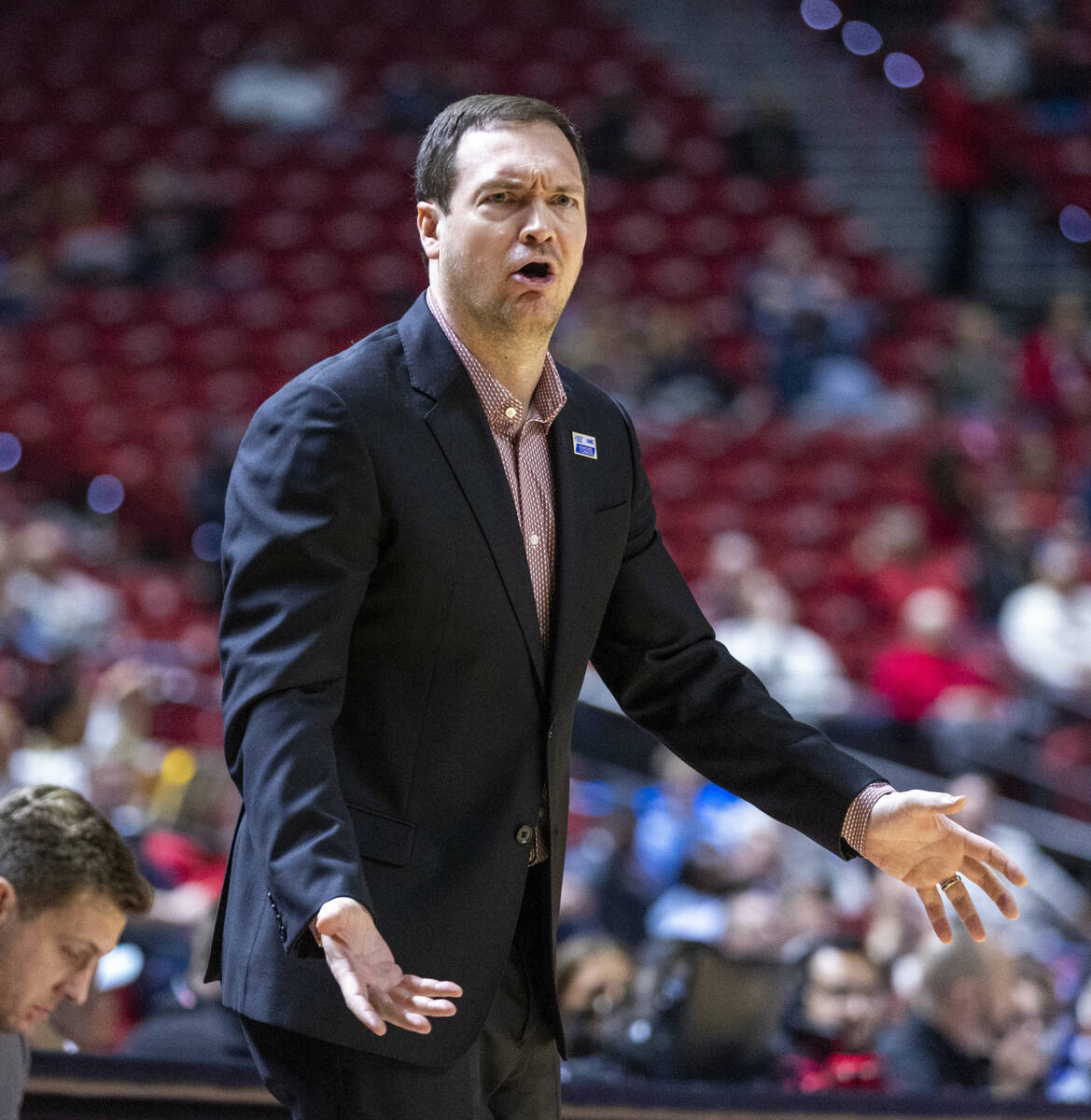 UNLV head coach Kevin Kruger is dismayed by the lack of another apparent foul call on the Air F ...