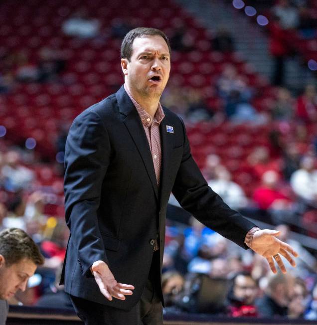 UNLV head coach Kevin Kruger is dismayed by the lack of another apparent foul call on the Air F ...