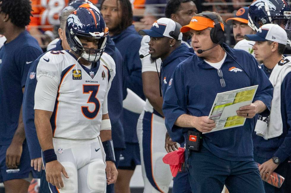 Denver Broncos quarterback Russell Wilson (3) stands behind head coach Sean Payton during the f ...
