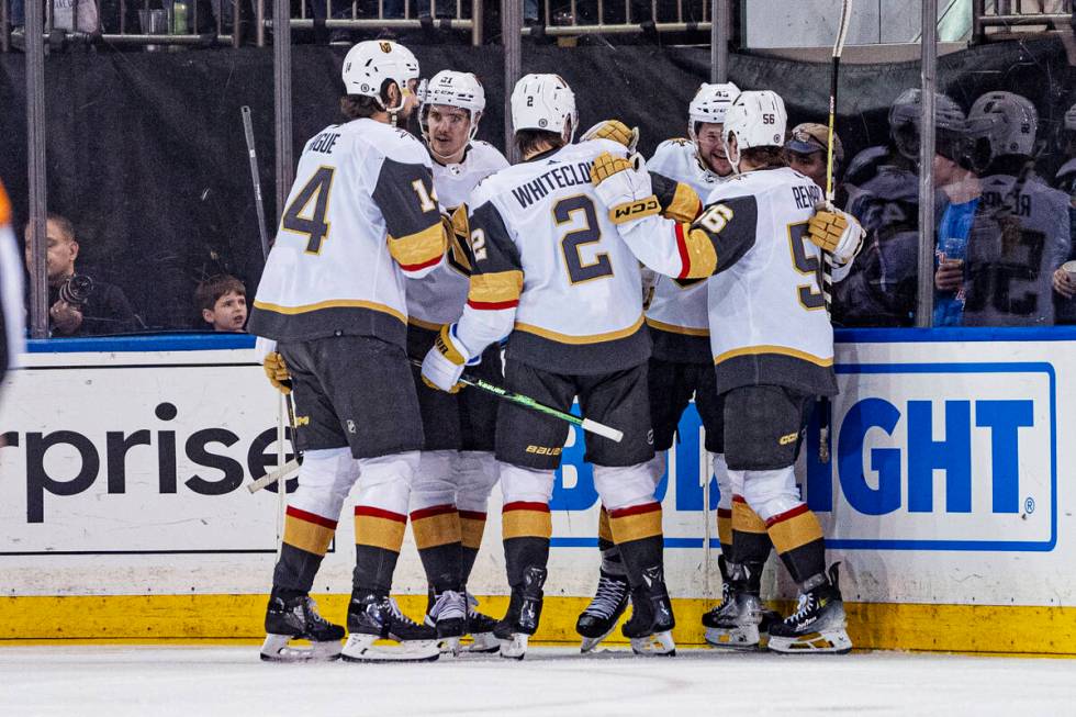 Vegas Golden Knights players celebrate a goal by right wing Sheldon Rempal against the New York ...