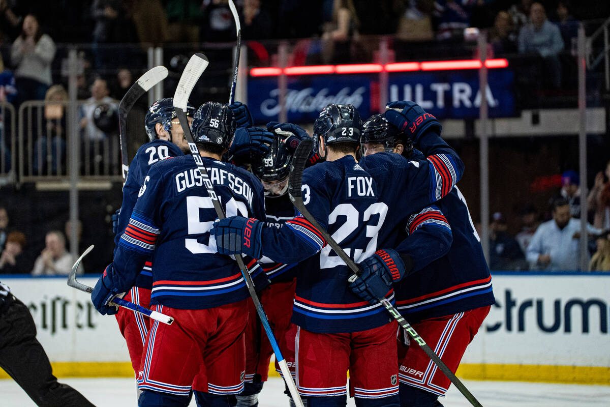 Vegas Golden Knights center Paul Cotter (43) and New York Rangers center Jonny Brodzinski (22) ...