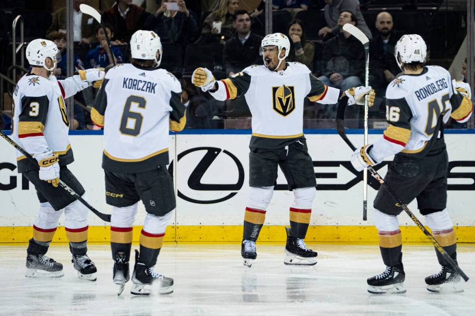 Vegas Golden Knights right wing Keegan Kolesar celebrates with teammates after scoring during t ...