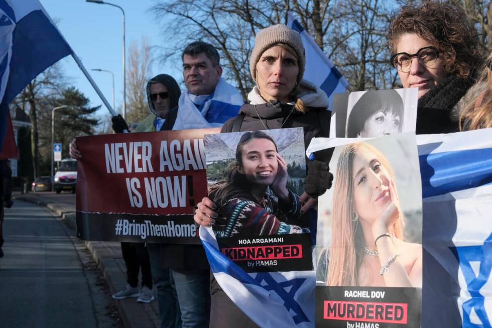 Pro-Israel activists gather near the International Court of Justice, or World Court, in The Hag ...