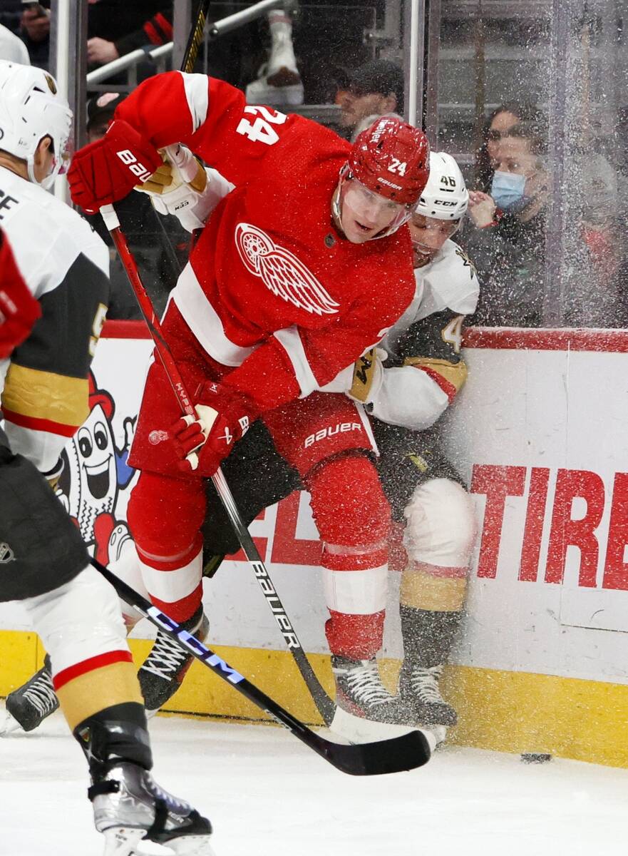 Detroit Red Wings center Klim Kostin (24) vies for a puck with Vegas Golden Knights right wing ...