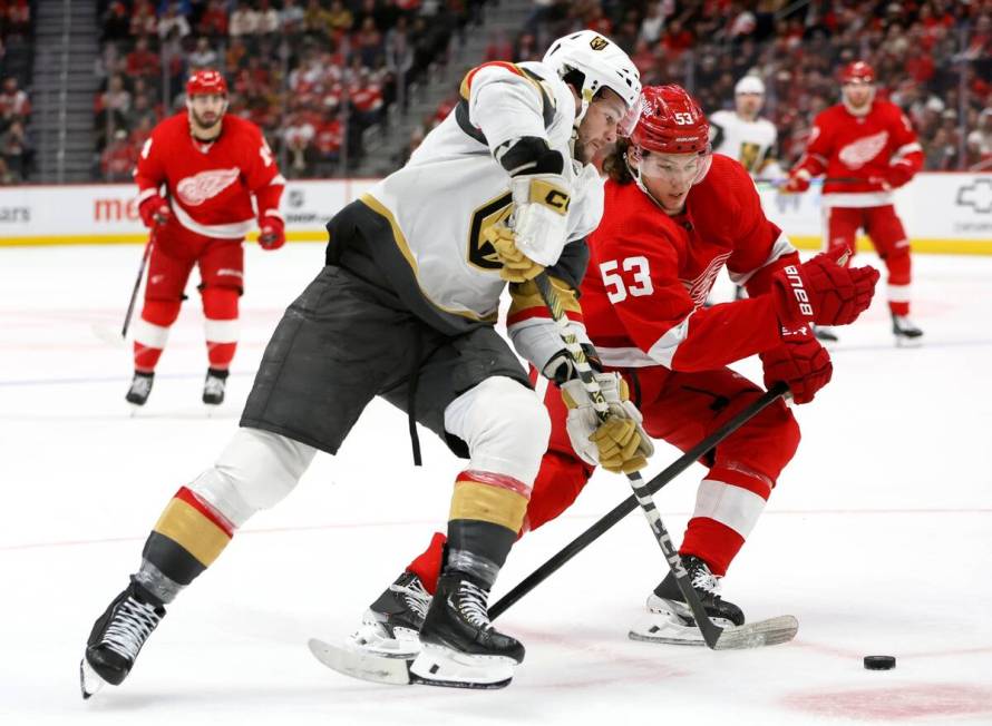 Vegas Golden Knights center Paul Cotter, front left, drives toward the goal against Detroit Red ...