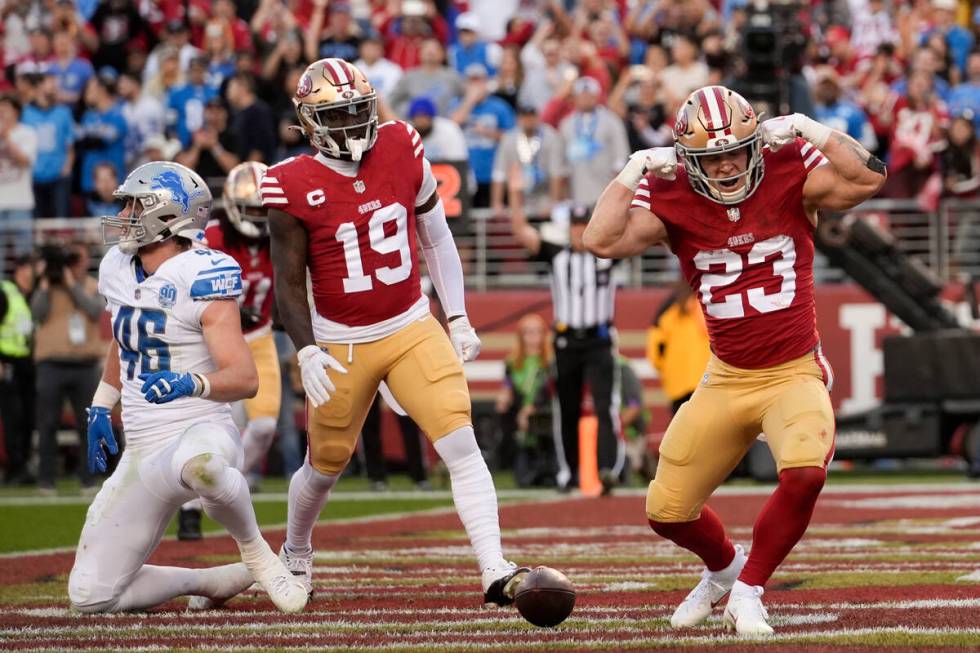 San Francisco 49ers running back Christian McCaffrey celebrates after scoring against the Detro ...